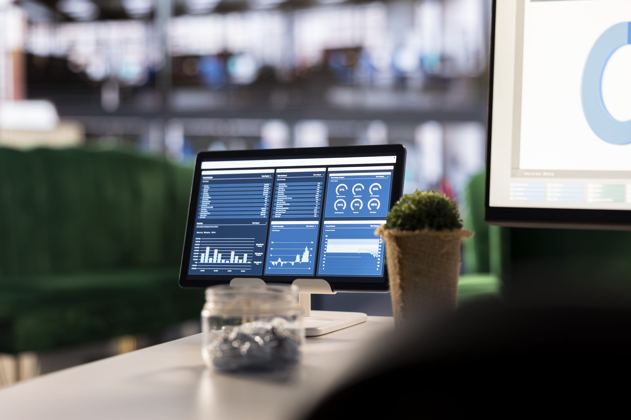 Modern executive workspace with a digital dashboard displaying marketing analytics and KPI charts, representing law firm marketing ROI measurement