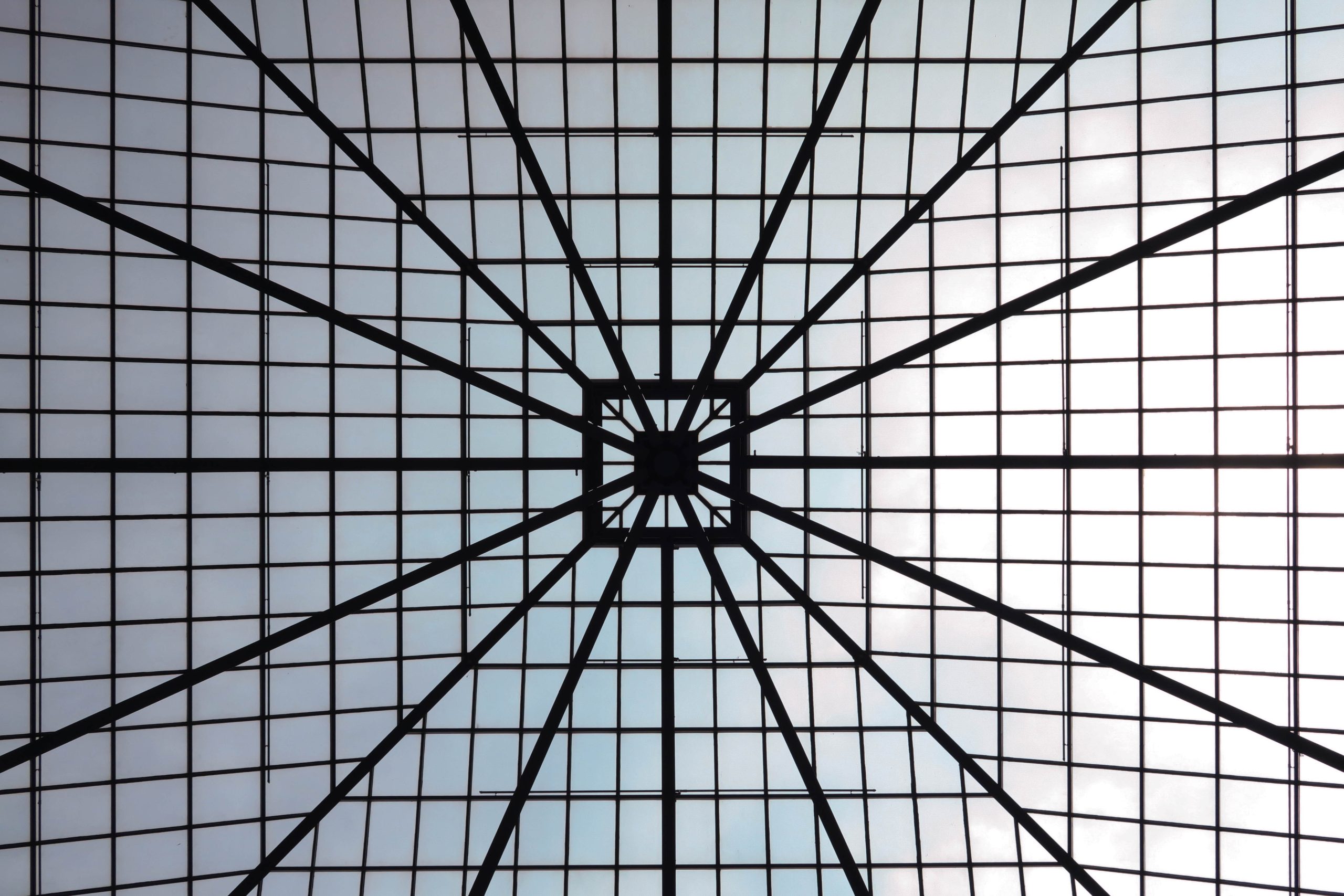 Abstract architectural roof structure of repeating geometric segments, representing distinct practice-area content clusters