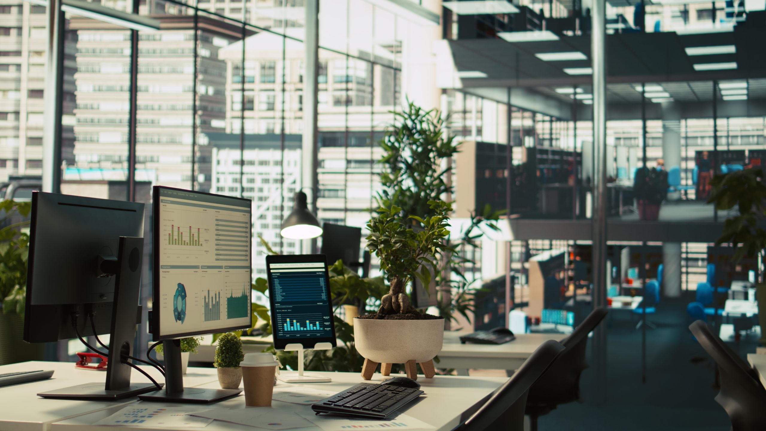 Office displays showing financial charts and KPI metrics, representing AI-era marketing ROI attribution for law firms