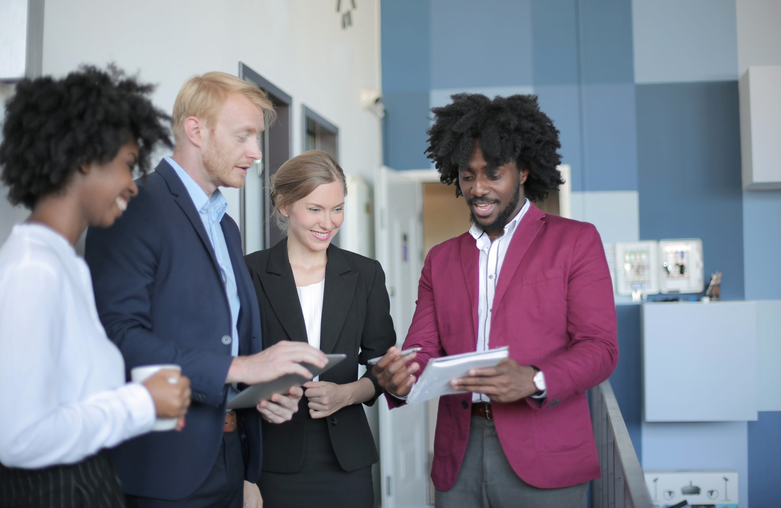 Diverse group of law firm partners and lateral hire candidates meeting in a modern office setting