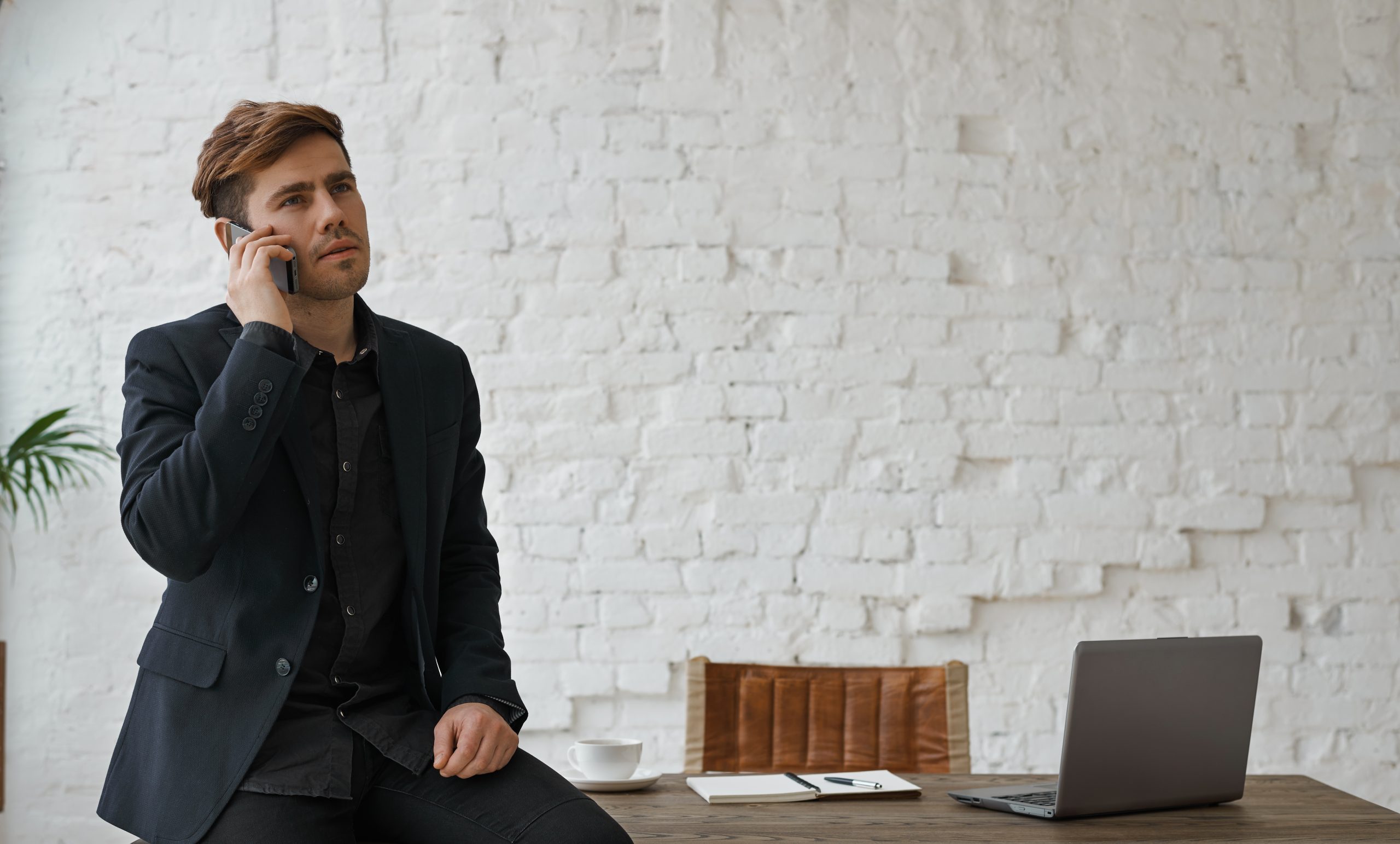Attorney answering a client call promptly at a modern office desk, representing fast law firm lead response