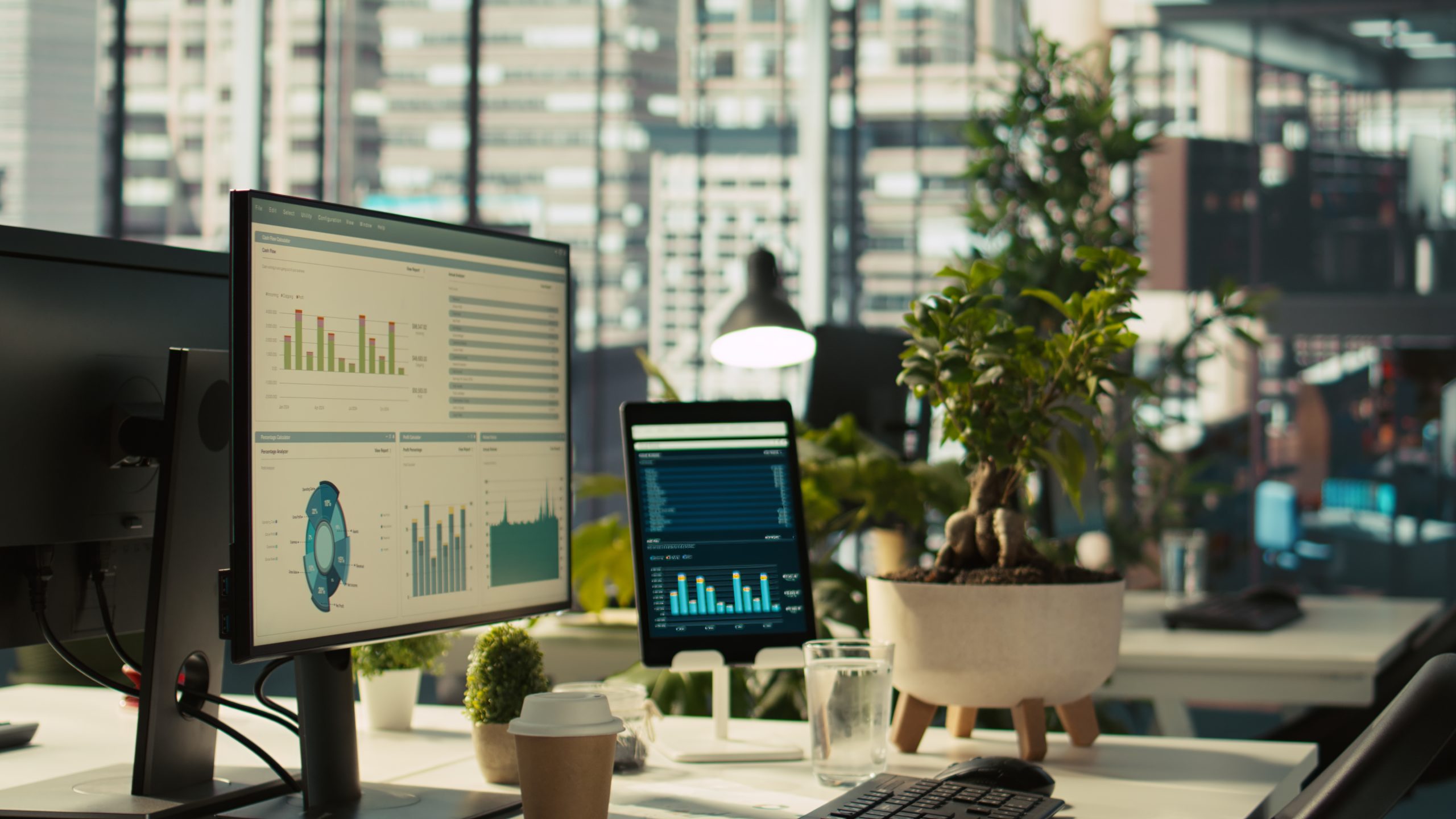 Modern law firm marketing office workspace showing analytics dashboards on dual monitors, representing the shift in digital ad campaign management